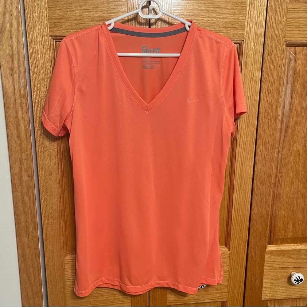 Coral Nike Dri-fit v neck top. Size Lg Swoosh is tonal. Short sleeve Reg…